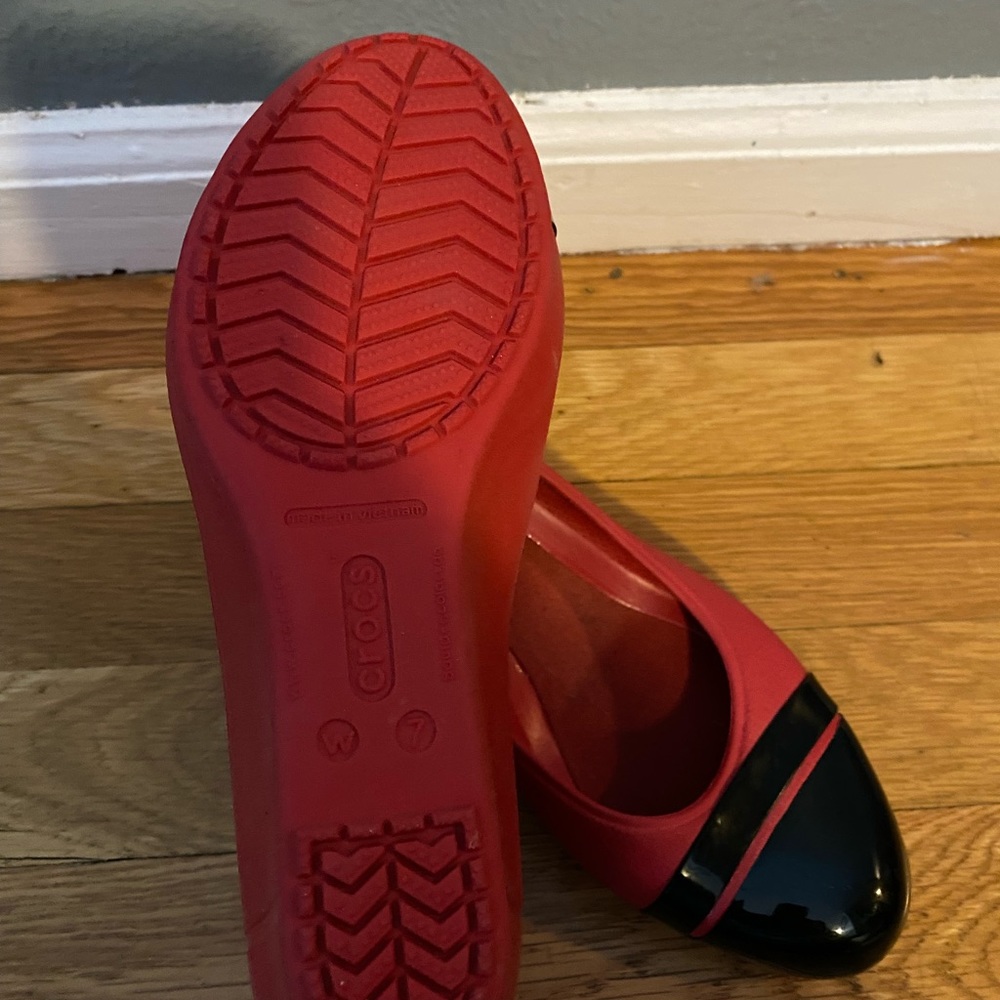 Red and a strip of black crocs shoes.